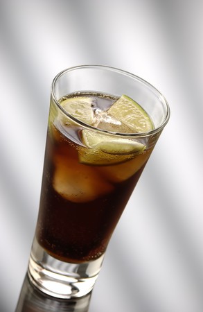 Cuba Libre with pieces of lime in collinsglassの写真素材