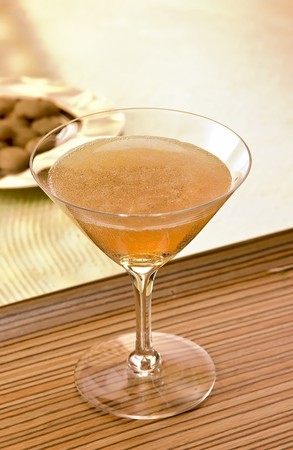 Midnight Moon cocktail with cookies in the backgroundの写真素材