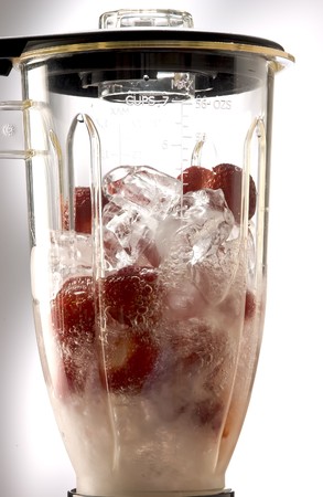 Strawberry and ice cubes Side view in a mixer.の写真素材