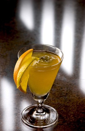Sidecar Cocktail with slices of apple and lemonの写真素材