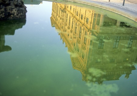 reflection of a castle in blue and green waterの写真素材