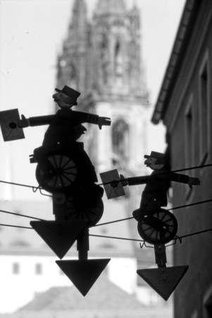 Metal figures walking on a ropeの写真素材