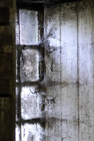 Old Window covered with spider webs.の写真素材