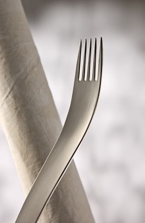 Designer fork in front of light background.の写真素材