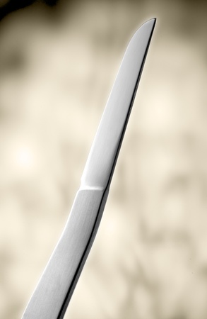 Designer knife in front of light background.の写真素材