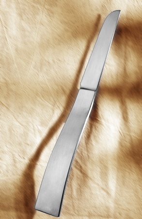 Designer knife in front of light background.の写真素材