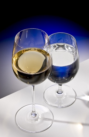 glasses of white wine and waterの写真素材