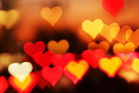 Blurred valentine background with heart-shaped highlights.の写真素材