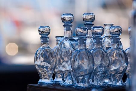 Glass bottles. Shallow DOF, focus on central bottles.の写真素材