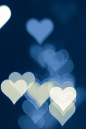 Blurred valentine background with heart-shaped highlights.の写真素材