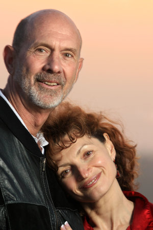 Loving senior couple outdoors. Close-up, shallow DOF.