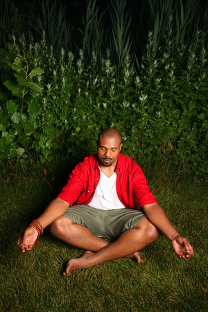 African American man practicing yoga outdoorsの写真素材