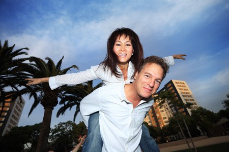 Mid-adult couple having fun outdoorsの写真素材