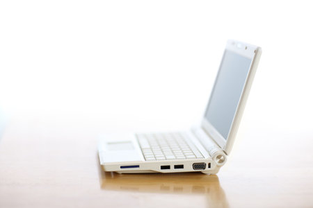 Ultra-portable notebook computer on table. Shallow DOF.の写真素材