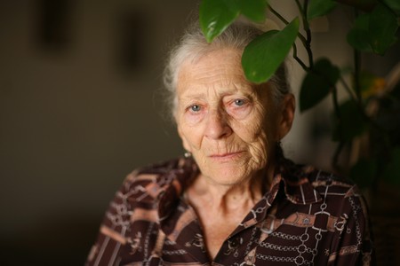 Portrait of a senior woman at home, thinkingの写真素材