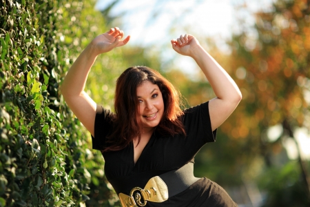 Joyful plus size woman outdoors. Shallow DOF.の写真素材