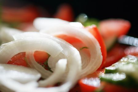 Fresh onion rings in greek salad. Close-up, shallow DOF.の写真素材