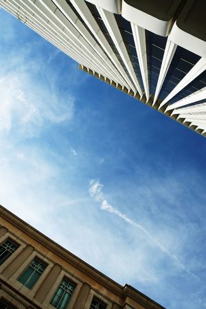 Urban buildings rising to the blue skyの写真素材