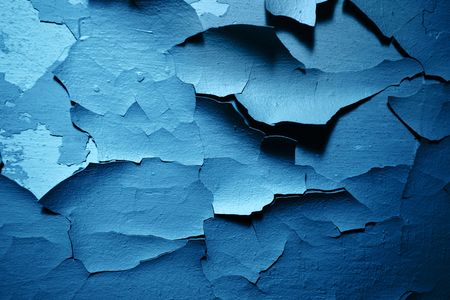 Old paint peeling from wall texture backgroundの写真素材