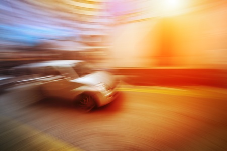 Long exposure shot of car moving in blurred motion on bright colorful background. Intentionally blurred.の写真素材
