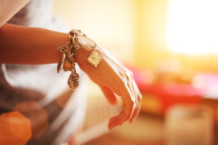 Female hand with silver bracelet jewelry. Closeup, shallow DOF.の写真素材