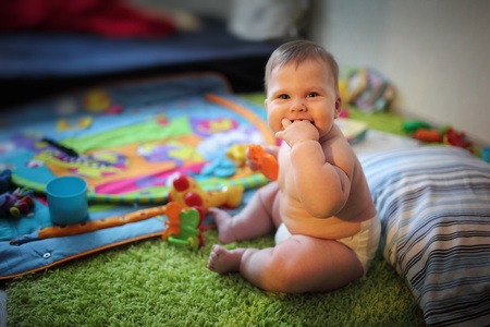 Portrait of happy baby girl at home. Closeup, shallow DOF.の写真素材