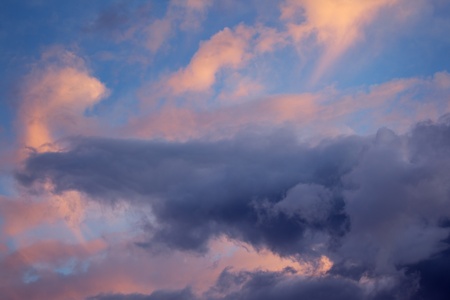 Dramatic clouds at sunset sky, closeup.の写真素材