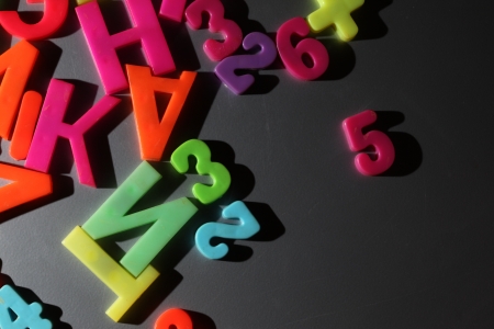 Colorful letters on gray metallic backgroundの写真素材