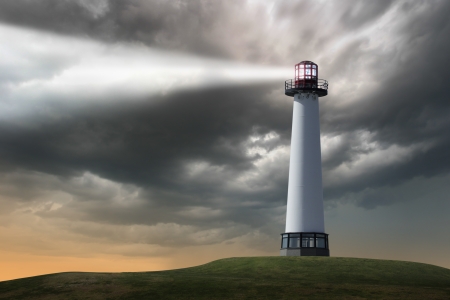 Lighthouse beaming light ray over stormy clouds の写真素材