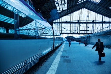 Train and travelers in a railroad train station.のeditorial素材