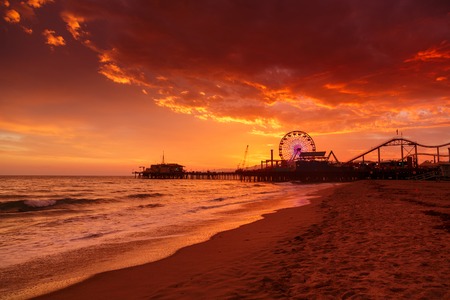 Santa Monica Pier Ferris Wheel over sunset sky background. Los Angeles, California.の写真素材