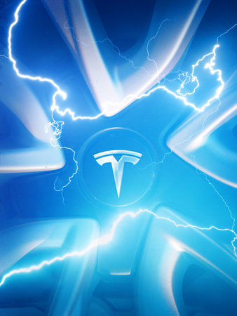LOS ANGELES, CALIFORNIA - August 2021: Tesla logo on Tesla Model 3 rim, multiple exposure combined with power electric lightning bolts in blue sky.のeditorial素材