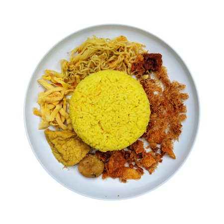 Nasi kuning or nasi kunyit on white plate, isolated on white background, top viewの写真素材