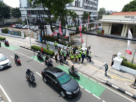 Riot police control the traffic on the road.の写真素材
