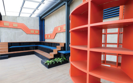 interior of a modern office building, reception desk with red wallの写真素材