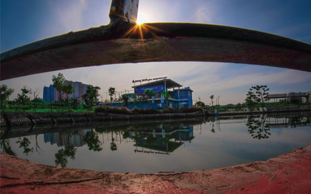 Reflection of building in the lake in the parkの写真素材