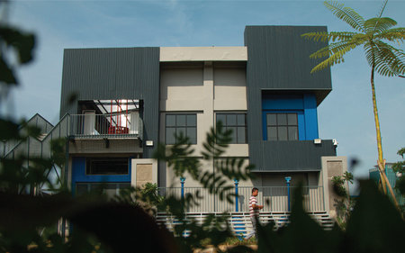 Modern house with blue sky and green leaves backgroundの写真素材