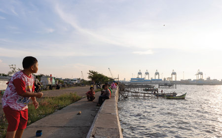 Unidentified  people are fishing in river.の写真素材