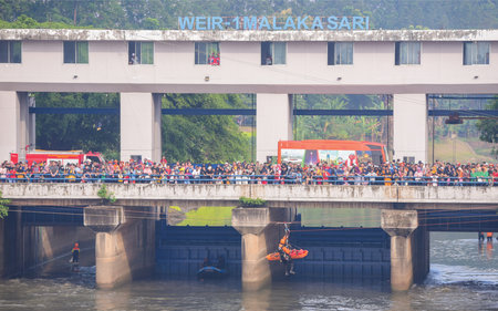 Unidentified people cross riverの写真素材