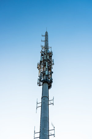 Mobile phone transmitter against blue sky