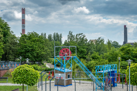Zabrze, Poland - June 19, 2023: Park 12C in Zabrze near Queen Luiza Adit. Educational zone and playground. Playground toys stylized as mining infrastructure devices.のeditorial素材