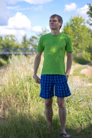 A young man spends time outdoors on a sunny dayの写真素材