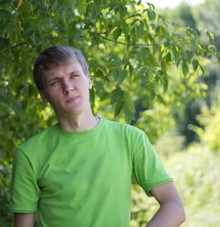 A young man spends time outdoors on a sunny dayの写真素材