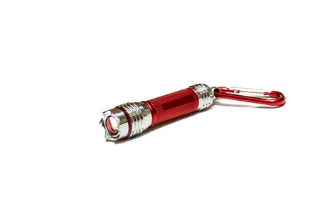 Red metal flashlight isolated on white background. Studio shotの写真素材