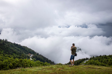 Epic view from the mountain to the sea from the clouds in the center