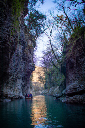 Scenic Canyon River Featuring Lush Greenery Surrounded by Nature at Beautiful Twilight