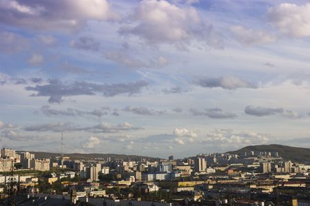 Small northern city among green hillsの写真素材