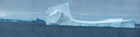 Antarctic ice island with penguins  in atlantic oceanの写真素材