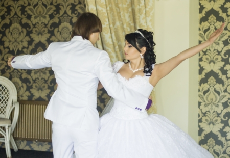 Bride and groom dancing the first dance at their wedding dayの写真素材