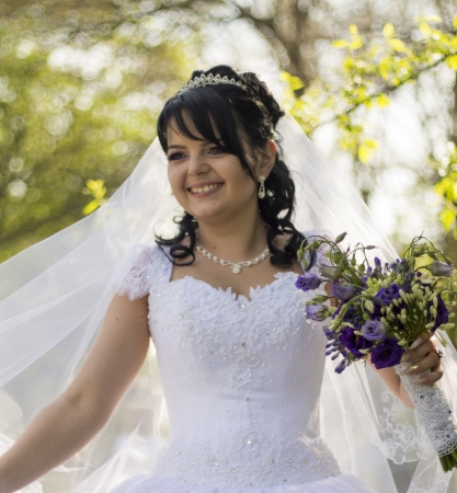 Beautiful bride posing in her wedding dayの写真素材